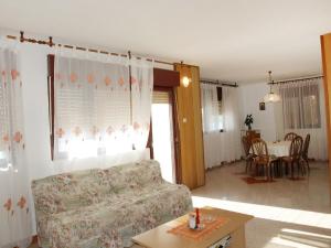 a living room with a couch and a table at Apartment Agneza by Interhome in Brgulje +11 photos