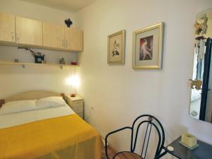 Postel nebo postele na pokoji v ubytování Holiday Home Mirta by Interhome