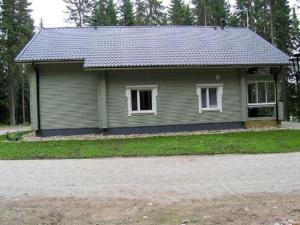 a small house with a driveway in front of it at Holiday Home Kärkelä by Interhome in Sulkava