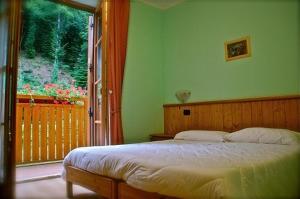 Ein Bett oder Betten in einem Zimmer der Unterkunft Il Picchio