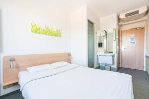 Posteľ alebo postele v izbe v ubytovaní ibis budget Torun