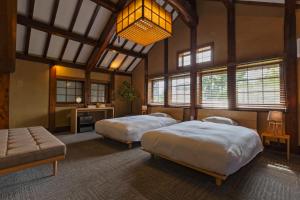 NIPPONIA HOTEL NARA NARAMACHI客房内的一张或多张床位