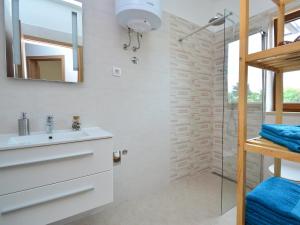 a bathroom with a sink and a shower at Apartment Kika-1 by Interhome in Ližnjan