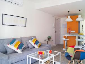 a living room with a couch and a table at Apartment Estrella del mar by Interhome in Rincón de la Victoria