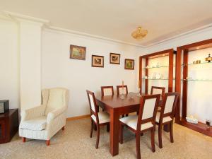a dining room with a table and chairs at Apartment Rambla de Tossa by Interhome in Tossa de Mar
