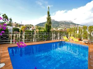 a swimming pool with a view of a mountain at Holiday Home Junio by Interhome in Calpe