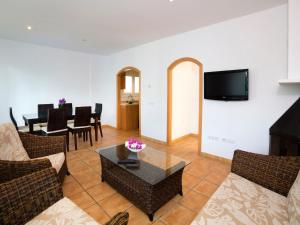 a living room with a couch and a table at Holiday Home Junio by Interhome in Calpe