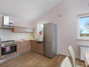 Kuchyň nebo kuchyňský kout v ubytování Holiday Home Bura by Interhome