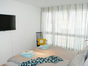 Postel nebo postele na pokoji v ubytování Apartment LaVille B-3-2 by Interhome