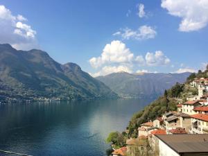 a view of a body of water with mountains at Apartment Sabrina by Interhome in Nesso