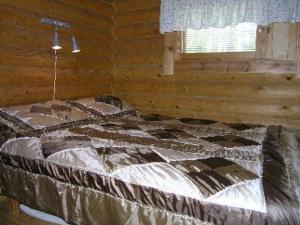 A bed or beds in a room at Holiday Home Mökinniemi by Interhome
