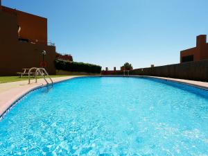 The swimming pool at or close to Holiday Home Vistamar by Interhome