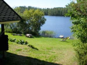 a view of a lake from the backyard of a house at Holiday Home 6144 by Interhome in Jäniskylä