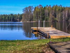 a dock on the side of a lake at Holiday Home Rantaheikari by Interhome in Torvoila