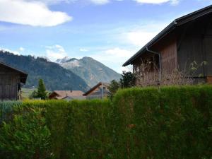 a view of a house and a mountain at Apartment Simmental by Interhome in Zweisimmen
