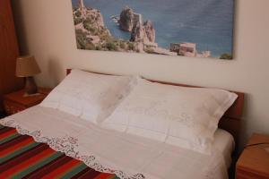 Un ou plusieurs lits dans un hébergement de l'établissement Baglio Gammicchia B&B