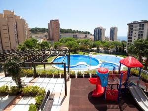 a view of a swimming pool with a playground at Apartment Luz de Calpe I-3 by Interhome in Calpe