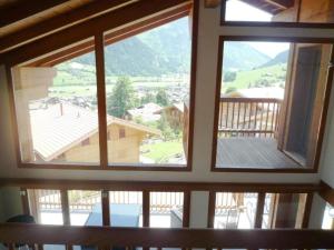 a view from the top of a window in a house at Apartment Nubes- Chalet by Interhome in Zweisimmen