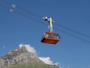 a ski lift in front of a mountain at Apartment Sörenweg 4 by Interhome in Engelberg