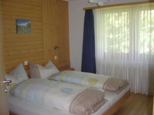 מיטה או מיטות בחדר ב-Haus Le Mirage