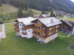 an aerial view of a large house in the mountains at Apartment Weideli by Interhome in Saas-Grund