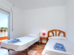 A bed or beds in a room at Holiday Home Villa Santa Marta II by Interhome