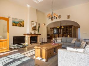 a living room with a couch and a tv at Villa Salvador by Interhome in Monte Pego