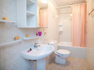 a bathroom with a sink and a toilet and a shower at Holiday Home AmareMonte by Interhome in Benissa