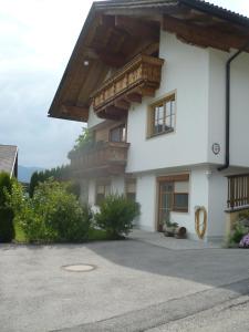 a large white building with a balcony on it at Appartement Gasser in Anras