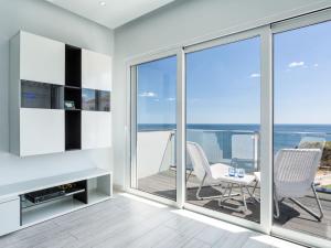 a living room with a view of the ocean at Studio Dream View 50m from the beach by Interhome in Albufeira