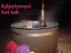 a hot tub with a lit candle in it at Holiday Home Pikkutupa by Interhome in Hyyrylä