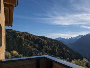 a balcony with a view of a mountain at Apartment Huwetz 3 1-2 Zimmerwohnung by Interhome in Bettmeralp