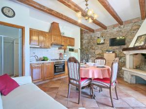 a kitchen and dining room with a table and chairs at Holiday Home Panorama 2 by Interhome in Labin +31 photos
