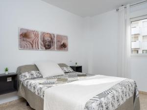 A bed or beds in a room at Apartment Carihuela Playa-2 by Interhome