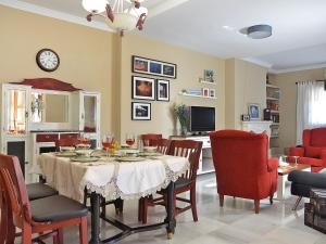 a dining room with a table and chairs at Holiday Home Torreon de Morayma by Interhome in Baena