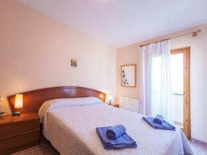 Posteľ alebo postele v izbe v ubytovaní Holiday Home Miro by Interhome