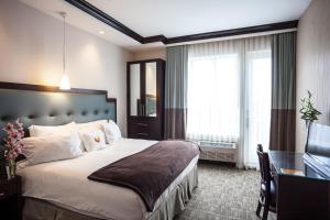 Postel nebo postele na pokoji v ubytování Aura Hotel Brooklyn