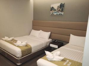 Postel nebo postele na pokoji v ubytování Hotel Costa Brava