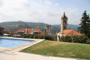 a view of a building with a clock tower at Casa Quinta da Calçada Douro in Cinfães