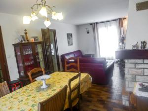 a living room with a table and a couch at Holiday Home Les Fées-1 by Interhome in Hyères