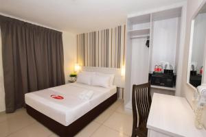 a hotel room with a white bed and a desk at My Hotel @ Sentral in Kuala Lumpur +21 photos
