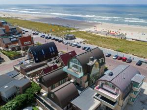 an aerial view of a beach with buildings and the ocean at Apartment De Zeeparel by Interhome in Egmond aan Zee