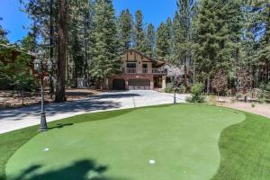 a golf course in front of a house at The Lodge at Snow Summit Home in Big Bear Lake