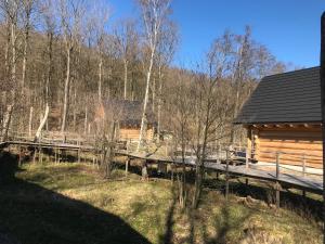 a log cabin in the woods next to a forest at Walden Cabin in Steninge