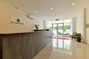 a lobby of a dental office with a reception counter at Fumah Hotel Jalan Kuching in Kuala Lumpur