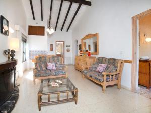 a living room with two couches and a coffee table at Apartment Ondina 01 in La Canuta