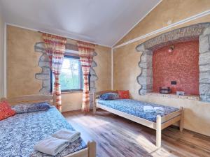 Łóżko lub łóżka w pokoju w obiekcie Holiday Home Darija by Interhome