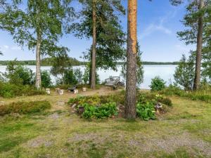 a view of the lake from the backyard of a house at Holiday Home Rantapirtti by Interhome in Niskamäki