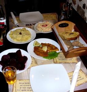 a table with plates of food on a table at 24 Seven Boutique Hotel in Malia