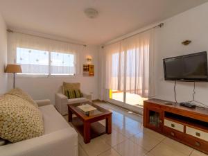 A television and/or entertainment centre at Apartment El Bosque by Interhome